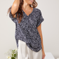 Faye - Meander: V-neck top with binding detail